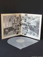 Gatefold opened showing inner artwork and vinyl in sleeve