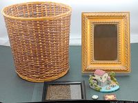 Group shot showing basket, mirror, carving, figurine