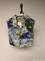 Front of youth Bongo sleeveless crop top showing tropical print and buttons