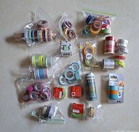 All bags of assorted washi and decorative tape rolls laid out