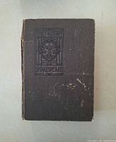 Front cover showing title panel and cover wear