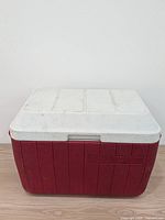 Front view of closed red Coleman cooler
