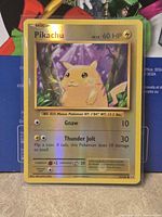 Front of sleeved Pikachu reverse holo card