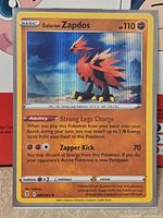 Front of Galarian Zapdos holo card showing artwork, set symbol, number 82/203