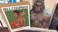 Bill Chapman poster and pastel study side by side on floor