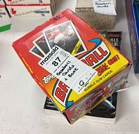 Partial 1988 Topps baseball card box with loose cards inside