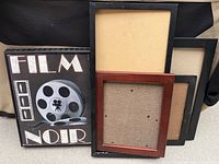 Group view of Film Noir art and four picture frames