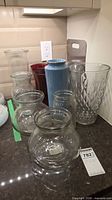 Group shot of assorted vases on countertop