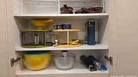cabinet view showing all items grouped on three shelves