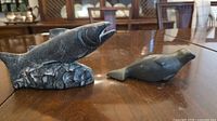 Fish and seal figurines on tabletop