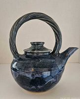 Front view showing glaze, body shape and handle