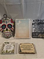 Group shot of all five hanging signs