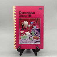 Front cover showing title, author, and comb binding