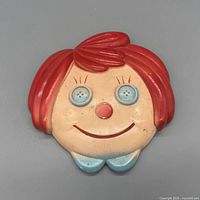 Front view of ceramic face plaque