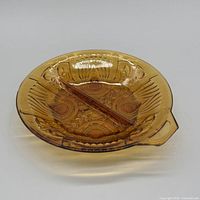 Top view of amber pressed glass divided relish dish