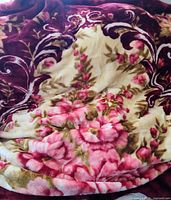 Close-up of floral design and burgundy border