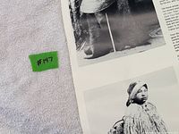 Lower section with historical photographs and paper edges