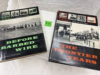 Front covers of both hardcover books with dust jackets visible