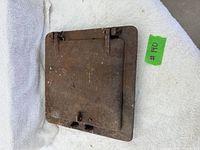 Front of cast iron hinged door with frame