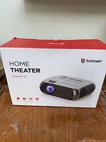 Retail box showing Bomaker home theater projector S5