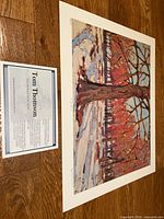 Print and info card on floor, full view