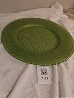Front view of green glass charger plate