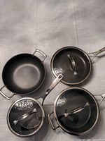 Overhead view of both pans and both lids