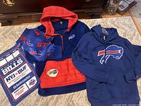 Overall view of lot showing both hoodies, scarf and rally towel