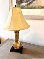 Full view of lamp with shade, base and finial