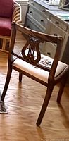 Rear view showing harp back design and needlepoint seat
