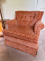 Front angled view showing armchair design, upholstery and condition
