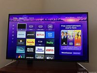 Front view showing powered-on Roku home screen