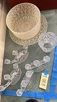 Overall lot showing bowl, plate underneath, additional plate, four candlestick holders, small vase