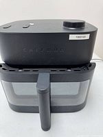 Front view of Chefman air fryer with basket inserted