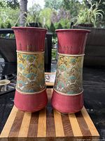 Front view of both Royal Doulton vases showing glaze colors and oriental panel