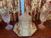 Group shot showing candy jar on mirror tray with two crystal hurricane candle holders