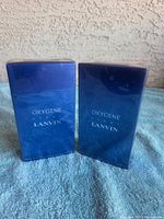 Front view of two sealed Oxygene Lanvin boxes