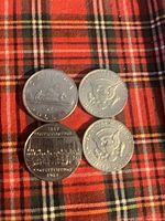 Obverse sides of all four coins displayed together