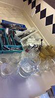 Overview of flatware in trays, glassware and organizers