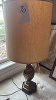 Full lamp next to window showing shade and base