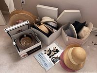 Overview of all hat boxes and loose straw hat