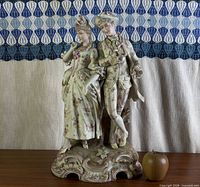 Full view of porcelain couple figurine on base
