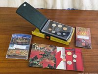 Group view of all four coin sets with packaging displayed