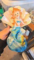 Front view of resin mermaid figurine showing overall design, colors and scale