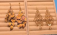 Both pairs of dangling earrings displayed in tray