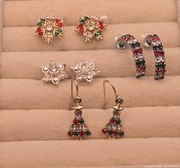 All four pairs of earrings displayed in jewellery tray