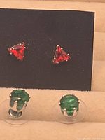 Overview of both earring pairs in display