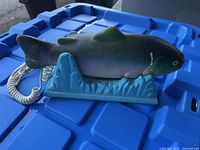 Side profile of fish telephone on base