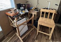 Overview showing desk, chair, easel, lamps and shredder