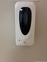 Front view of wall-mounted automatic dispenser